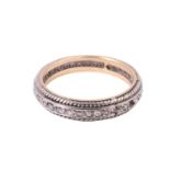 A diamond eternity ring, the old cut diamonds line set in precious white metal between rope