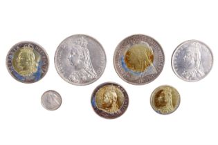 A group of Victorian silver coins, comprising two crowns, two half crowns, a florin, a shilling, and