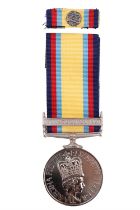 A replacement Gulf War medal with rosette on ribbon, (not named)