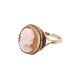 A shell cameo finger ring, comprising an oval cameo depicting a young lady, bezel set having a