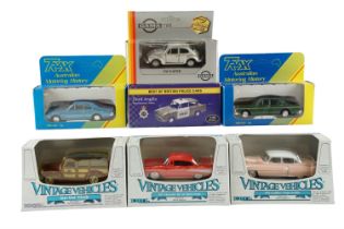 A group of boxed diecast toy cars, including ERTL Vintage Vehicles, Trax Australia, Gama, and a