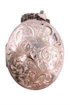 A silver double locket necklace, the front having engraved scrolling decoration, dependant from an