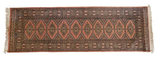 A Persian Bokhara silk-blend runner, 240 x 78.5 cm