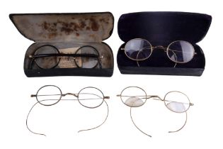 Four pairs of vintage spectacles, including two pairs with bi-focal lenses