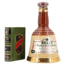 A small Wade Bells Scotch Whiskey decanter, 16 cm, together with a novelty Rutherfords whiskey