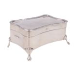 An Edwardian silver ring / trinket box, of serpentine form and having cabriole legs, Gorham,