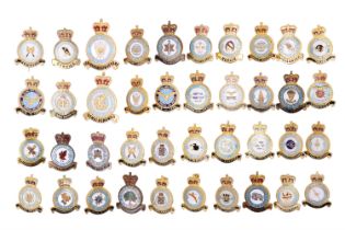 A large collection of RAF squadron lapel badges