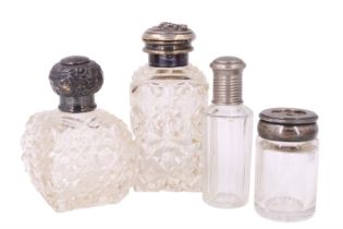 Two silver topped scent bottles and an electroplate mounted bottle, together with a 'diaphragm'