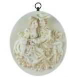 A late 19th Century continental porcelain plaque, high relief decorated with a romantic depiction of
