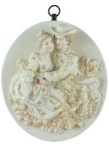 A late 19th Century continental porcelain plaque, high relief decorated with a romantic depiction of