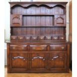 A late 20th Century Chapman's 'Siesta' oak dresser, having three drawers over cupboards and
