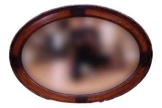 A George V oak framed oval mirror, 90 x 65 cm