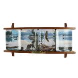 A set of four limited edition collector's plates, "Dawn's Call", together with a plate rack and