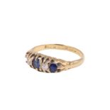 A George V sapphire and diamond finger ring, having two 2.5 mm old cut diamonds, line set between
