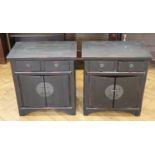 A pair of chinoiserie cabinets, the black lacquer finish distressed to red and having two drawers