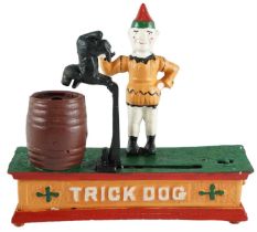 A vintage boxed cast iron Trick Dog money bank, 17 x 20 x 6 cm