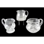 Three cut glass jugs, tallest 15 cm