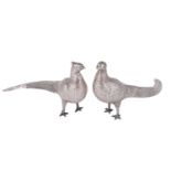 A pair of late 20th Century Peruvian white metal pheasant table ornaments, having chased and