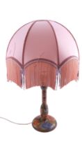 A large finely hand-painted and carved floral wooden table lamp, mark to base, 46 cm to socket