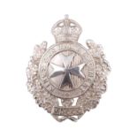 A King's Own Malta Regiment white metal cap badge, stamped silver and tested as such