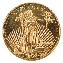 A miniature United States of America's Saint-Gauden's 20 dollar gold piece, "22 KT" gold, with