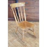 A Victorian hardwood provincial spindle back rocking chair, 85 cm