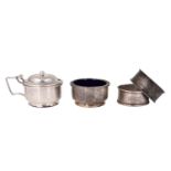 A small group of silver, comprising two condiments and two napkin rings, 71 g net, (a/f)