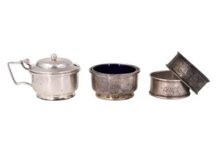 A small group of silver, comprising two condiments and two napkin rings, 71 g net, (a/f)