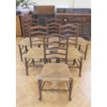 A set of six rush seated oak ladder-back chairs, late 20th Century, 92 cm high, (one chair a/f)