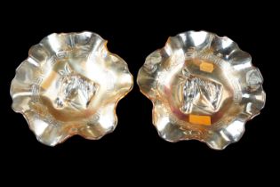 A pair of mid 20th Century pressed marigold carnival glass dishes, having raised horse profiles