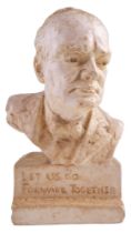 A plaster bust of Sir Winston Churchill bearing the inscription "Let Us Go Forward Together",