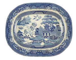 A blue-and-white Willow pattern ashet, 46 cm x 36 cm