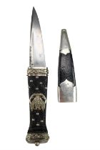 A Victorian army officer's sgian dubh, its carved wood grip bearing a badge of the 4th (