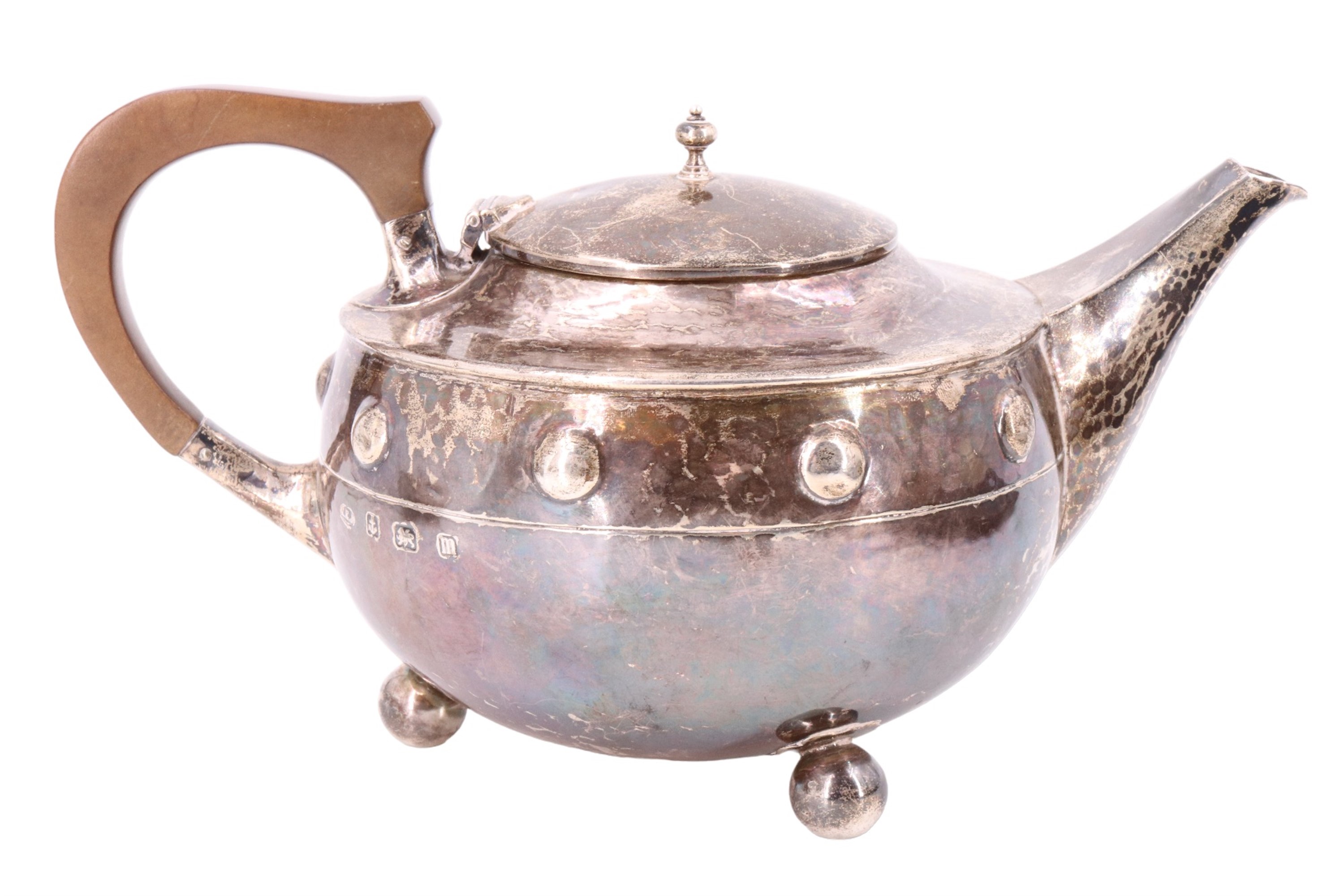 An Arts and Crafts silver bachelor tea set, of shouldered ovoid form and having a planished finish - Image 2 of 9