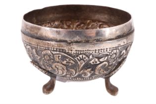 An early 20th Century Indian white metal condiment bowl, having chased scrolled and floral