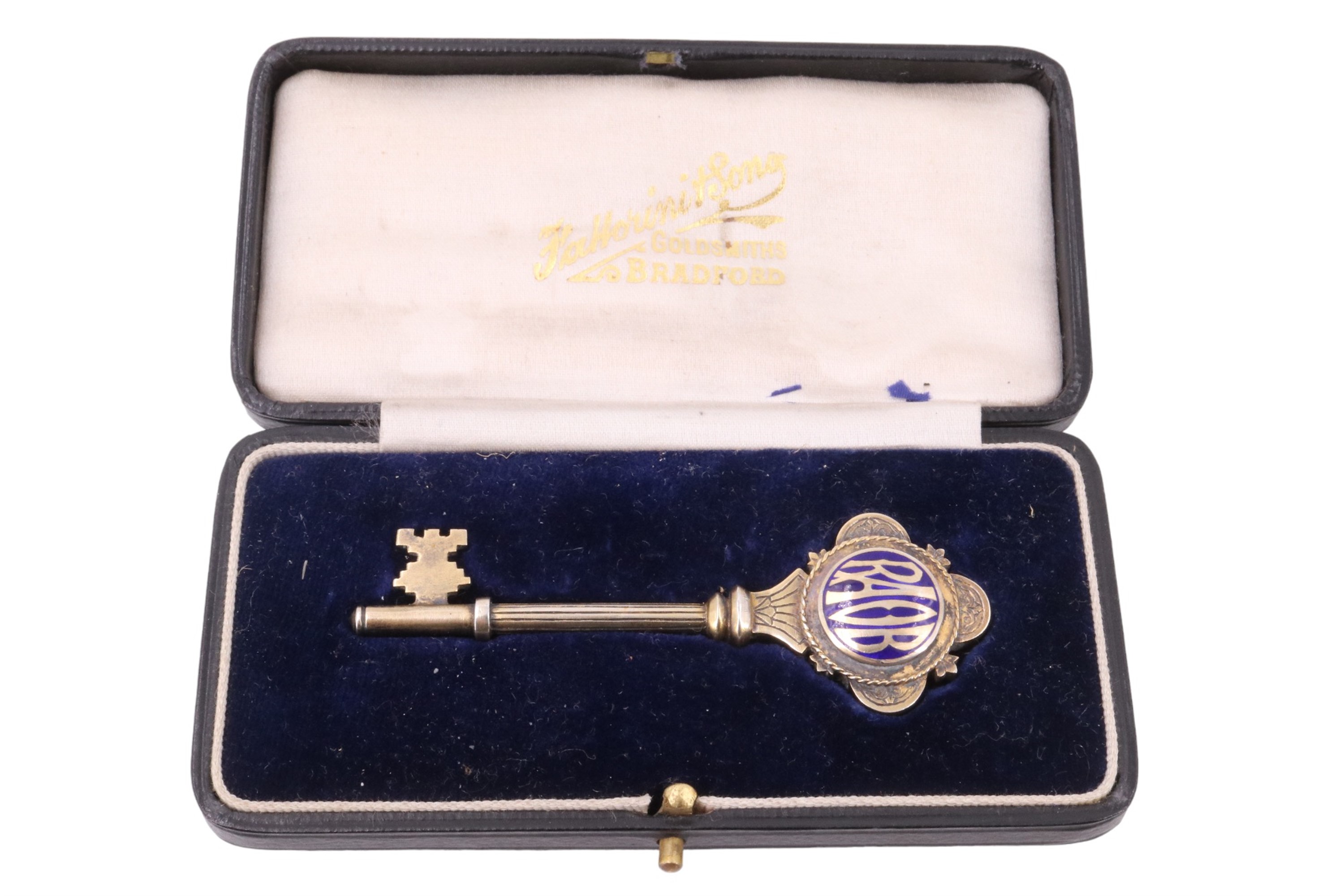 An enamelled gilt white-metal presentation key, engraved "Presented to Councillor J Blythe JP In - Image 3 of 3