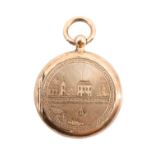 A vintage French gold triple locket, the front engraved with a church and house on a river