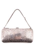 An Edwardian silver coin purse, decorated with engraved foliate scrolls, centred by a "C" monogram