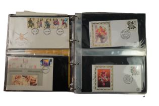 An album of Royal Mail first day stamp covers