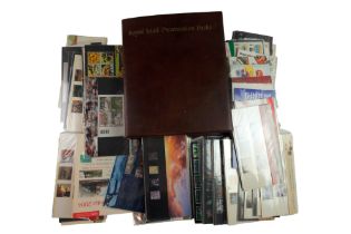 An album of Royal Mail Presentation Packs together with a large group of loose presentation mint