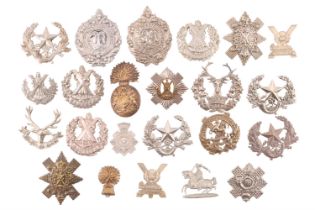 A collection of Scottish and related cap badges etc