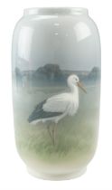 A Royal Copenhagen cylindrical vase decorated in depiction of a stork, 21 cm tall