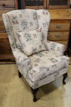 A contemporary tapestry upholstered wing back armchair, 105 cm