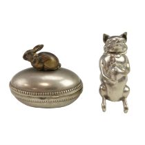 A novelty nickel plated vesta case in the form of a pig, having a hinged head / lid, the side