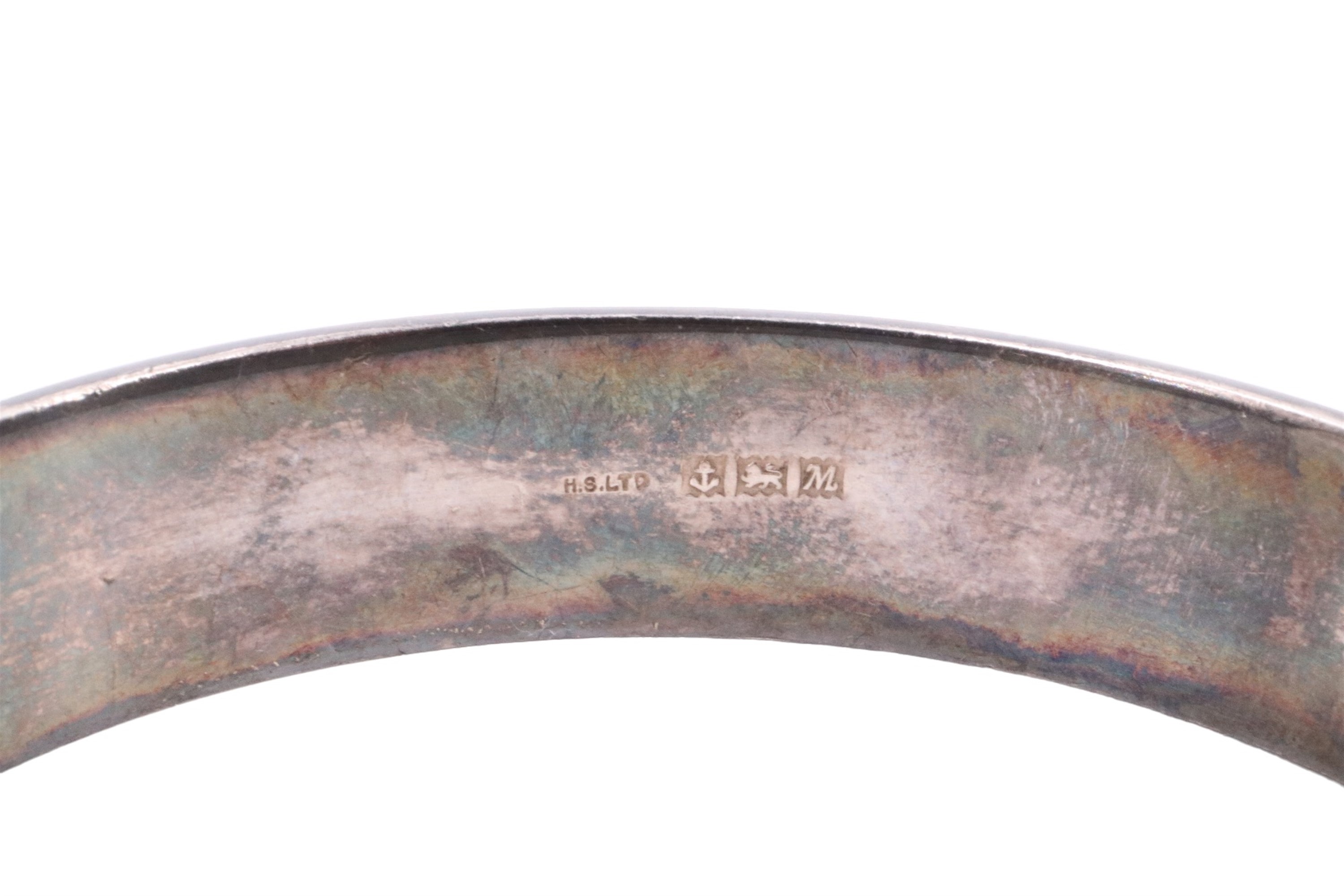 A 1960s silver bangle, decorated with engraved foliate scrolls, internal 54 x 57 mm, 26 g - Image 3 of 3