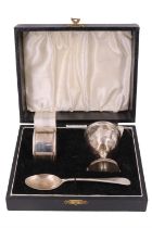 A cased silver Christening set, comprising napkin ring, pedestal egg-cup and matching Old English