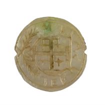 An antique mother-of-pearl seal matrix bearing an engraved Jerusalem cross on a shield with wreath