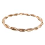 A contemporary Italian 9 ct gold cable bangle, having polished and textured twists, sprung hinge