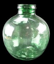 A bottle green glass car buoy / terrarium, 36 cm high