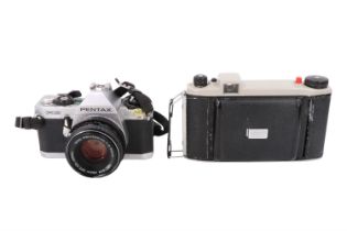 A cased Pentax MG 35 mm film camera together with a cased Kodak Junior II 620 mm film camera